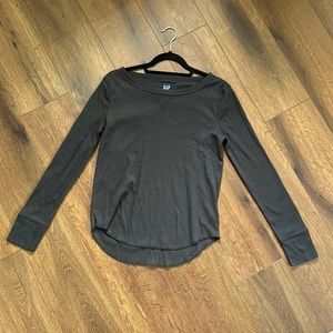 This is a G A P black knitted long sleeve shirt.